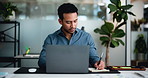 Laptop, research and writing with business man at desk in office for accounting or finance report. Computer, notebook and planning with accountant in financial workplace for audit or online review