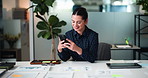Woman, phone and documents at office, writing or texting with mobile app at investment company. Person, broker and financial advisor on smartphone for insight, feedback or smile for deal at agency