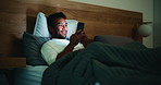 Night, home and happy man with cellphone, reading and  internet with social media, typing and email. Smile, smartphone and person in bedroom, ebook and blue light exposure with app for online column