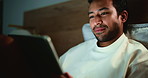 Evening, bedroom and man with tablet, reading and search for online article, social media and insomnia. Doom scroll, tech and person with ebook, home and blue light exposure with app, night and relax