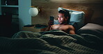 Man, phone and website in bed for temptation, self pleasure and masturbation in home. Night, secret and person with smartphone for pornography, addiction and sneaky activity in bedroom of apartment