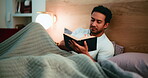 Faith, man and reading bible in bedroom, scripture and Christian with belief for religion and praise. Catholic, worship and person with book for spiritual guidance, home and holy literature on bed