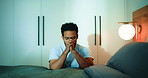 Man, prayer and faith in bedroom, night or worship with routine, connection or talk with God in home. Spiritual person, religion and eyes closed for gratitude, praise or Christian belief at apartment