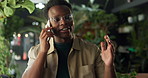 Black man, phone call and florist for talk at store, contact or deal with supplier at sustainable startup. African person, botanist and explain with smartphone, glasses or plants at eco friendly shop