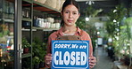 Woman, closed sign and florist at shop, face or sustainability with board at small business. Person, botanist and smile at store front, portrait or notice with pride at eco friendly startup in Mexico