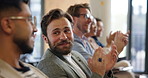 Applause, crowd and development with business man in conference room for seminar or workshop. Audience, corporate and support with employee people clapping in auditorium for presentation success