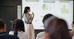 Business woman, graphs and presentation for speaker in seminar room with audience. Education, forum speech and statistics with corporate growth for public speaking, strategy and convention with crowd