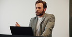 Businessman, speaker and podium with laptop for presentation, tradeshow or workshop in office. Man, spokesperson or meeting in auditorium for speech, pitch or company proposal in work conference