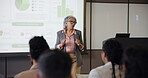 Seminar, graph and presentation with business woman at event for broker workshop, public speaking and conference. Lecture, convention and tradeshow expo with employees at summit for investor data