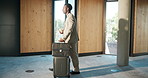 Business travel, employee and man with suitcase, hotel and arrival with coffee, realtor and walking. Lobby, real estate and black person with luggage for investment opportunity and trip with latte