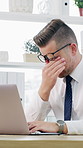 Laptop, stress and typing with business man at desk in office for burnout, eye strain or pressure. Computer, headache and tension with employee in workplace for deadline, migraine or frustration