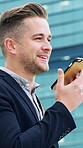 Phone, speaker and business man in city for real estate agent, communication and morning commute. Voice note reminder, realtor advisor and property negotiation with person outdoor for travel and chat