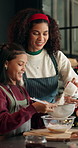 Christmas, mother or child in kitchen with baking, flour sift or bonding in holiday season. Festive, learning or family in house with ingredients, support or dessert preparation in cooking tradition.