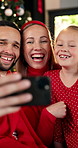 Face, selfie and parents with child, Christmas and celebration for festive event or profile picture. Happy, people and bonding with girl on holiday, flare and photography for Xmas and excited in home