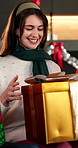 Christmas, woman and smile in home with gifts, gratitude and excited for festive bonding together. Family, apartment and Xmas with people, presents and giving for holiday season and happy tradition