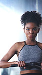 Rowing machine, breathing and training with woman in gym for fitness, cardio challenge or bodybuilder. Exercise equipment, wellness and African person in sport club for health and muscle development