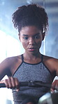 Rowing machine, breathing and fitness with woman in gym for training, cardio challenge or bodybuilder. Exercise equipment, wellness and African person in sport club for health and muscle development