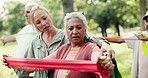 Personal trainer, group and old woman with resistance band in park, workout instructions and guidance. Retirement, coach directions or people with outdoor exercise class, fitness support and mobility