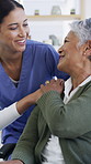 Holding hands, happy and nurse with senior woman in retirement home for bonding or compassion. Empathy, support and caregiver with elderly female patient in wheelchair at medical checkup in house.
