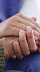 Holding hands, compassion and nurse with senior woman in retirement home for bonding or support. Empathy, trust and caregiver with elderly female patient for connection at medical checkup in house.