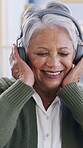 Dance, streaming or old woman in home with headphones, song or listening to music playlist. Happiness, sound or elderly person in house with tech, feeling beat or radio subscription on audio app.