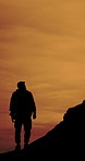 Hiking, thinking and back of man on mountain for adventure, journey and travel in morning. Space, reflection and silhouette of person for backpacking, trekking and wellness for fresh air or tourism