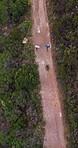Workout, drone or men with trail running on mountain for pace training, marathon practice or health. Aerial, people and cardio exercise on dirt road for endurance, fitness challenge and performance