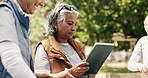 Volunteer, tablet and woman in park, typing and community service with online checklist. Mature person, outdoor or tech with social responsibility, connection or digital app for inventory or donation