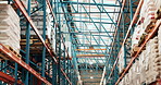 Empty, warehouse and shelves with stock, supply chain and distribution of goods, low angle or export. Factory, logistics and storage for cargo, freight and shipping of merchandise and wholesale