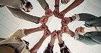 Below, team and fist bump in circle with unity, cooperation and collaboration for marketing goals. People, hands together or united in office with solidarity, connection and support for advertising.