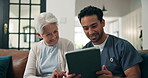 Smile, caregiver and old woman with tablet in home for good news, medical results and diagnosis. Happy, nurse and elderly person with digital for healthcare report, browsing web and assisted living