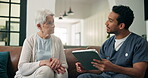 Tablet, support and nurse with old woman on sofa for medical, advice, talking or retirement. Elderly care, online healthcare report and caregiver with senior patient and man with tech in nursing home