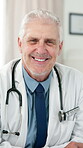 Medical, face or mature doctor in hospital with stethoscope, job goals or career pride in healthcare. Portrait, happy or man with confidence, general practitioner or experience in clinical industry.