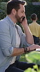 Smile, phone call and man in backyard, father and digital app for communication. Outdoor, parent and person in garden, relax and smartphone for chatting, conversation and break with humor or laughing