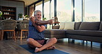 Man, stretching and pilates on mat, home and workout routine in living room, warm up and flexibility. Healthy, mature person and exercise preparation on floor, balance and active for fitness in house