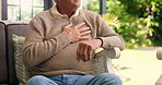 Senior man, hands and chest pain with cough for bronchitis, heart condition or illness in home. Sick, elderly or male person with sore ache for viral infection, disease or pneumonia on sofa in house