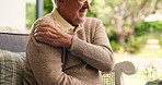 Senior man, shoulder pain and injury with stress on sofa for muscle tension or fibromyalgia in home. Hands, elderly or male person with sore strain, pressure or ache for fatigue or stiffness in house