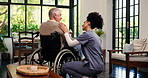 Elderly man, nurse and patient with wheelchair in home for diagnosis, assisted living or care. Healthcare, caregiver and helping senior person with a disability for health advice or recovery in house