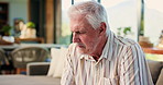 Elderly, sad man and crying with regret for past mistake, loss or grief on living room sofa in home. Senior, male person or emotional with old memory, nostalgia or mourning lost love for loneliness