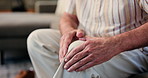 Elderly man, hands and knee pain with injury for strain, pressure or muscle tension in home. Closeup, senior or male person with sore bone or ache for arthritis, joint inflammation or sprain in house