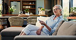 Watching tv, home and woman with remote on couch, entertainment or subscription for movie on website. Happy, mature person and change channel with controller, chilling and streaming film in lounge