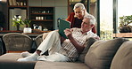 Tablet, talking and senior couple on sofa with planning for retirement vacation together in home. Conversation, technology and elderly people in living room with booking flight tickets in house.