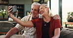 Happy, selfie and senior couple on sofa in home for memory, bonding and social media post together. Smile, relax and elderly man with woman for photography picture on weekend in living room at house.