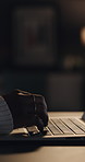 Typing, dark and hands of person on laptop for copywriting, editing and article review in home. Remote work, online and person on computer keyboard for journalism, news report and research at night