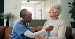 Senior, woman or nurse with stethoscope for heart rate monitoring or healthcare exam in home. Female person, caregiver and listening with chest, breathing or elderly patient for hypertension in house