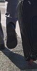 Legs, walking or businessman in city with suitcase, travel journey or attendance of corporate seminar. Commute, stroll or employee in town with luggage, company trip or flight for conference event.