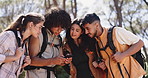 Friends, phone and hiking in woods, planning and search for location, direction or backpacking on holiday. People, smartphone and group with mobile app, tourism or scroll on map with bag in forest