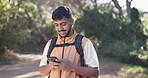Phone, backpacking and man outdoor for hiking on vacation, getaway or weekend trip with texting. Nature, cellphone and male person with trekking blog on mobile app for exploring trip in woods.
