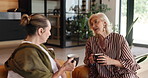 Conversation, senior friends and coffee cup on couch for bonding, reunion gossip and catch up session. Speaking, storytelling and elderly women with caffeine drink in home, weekend visit and support