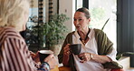 Friends, relax and women with coffee, talking and bonding with gossip in home, happy or conversation. Mature people, discussion and together with tea in lounge, smile and listening to story in house